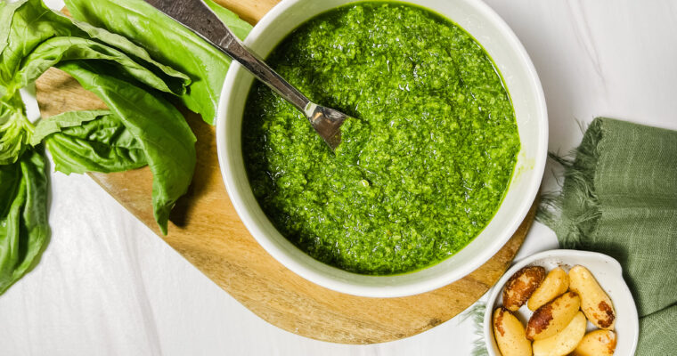 a fresh display of basil pesto with brazil nuts and basil leaves